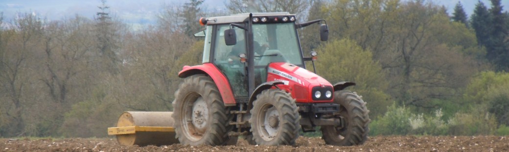 He's rolling a field ready for sowing.