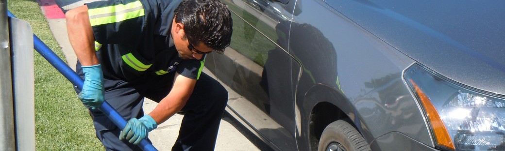 Miguel fixes a puncture on my rental car
