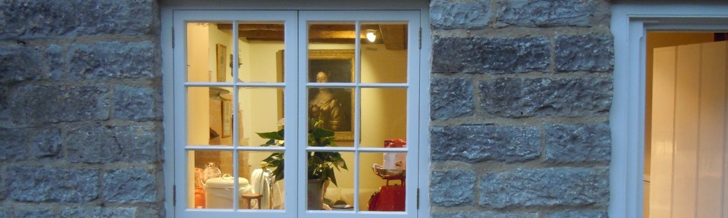 A Lighted Window on a Winter Evening